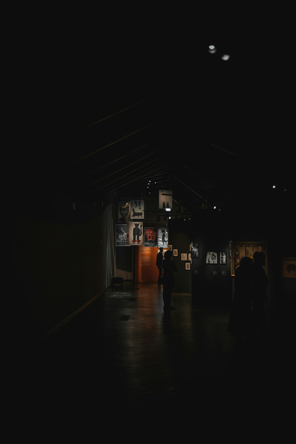 a group of people standing in a dark room