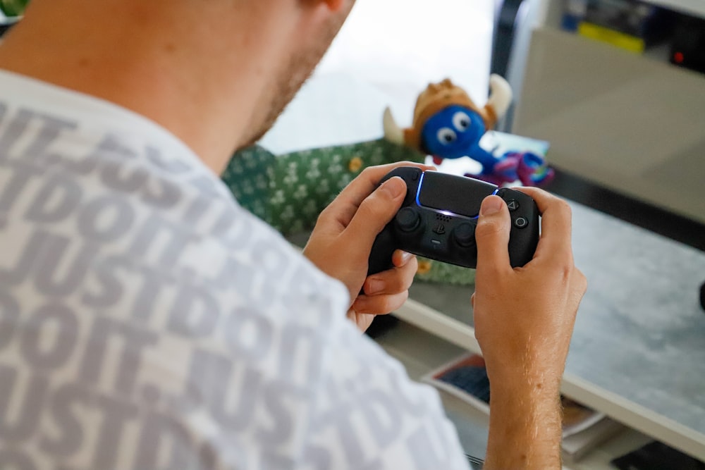 a man playing a video game with a remote controller