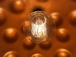 a light bulb hanging from a ceiling in a room