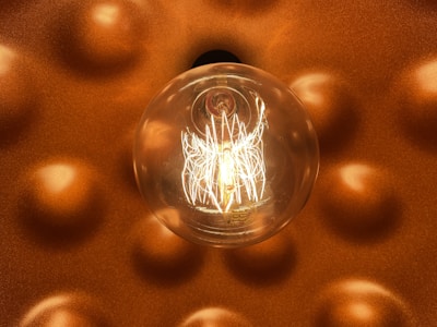 a light bulb hanging from a ceiling in a room