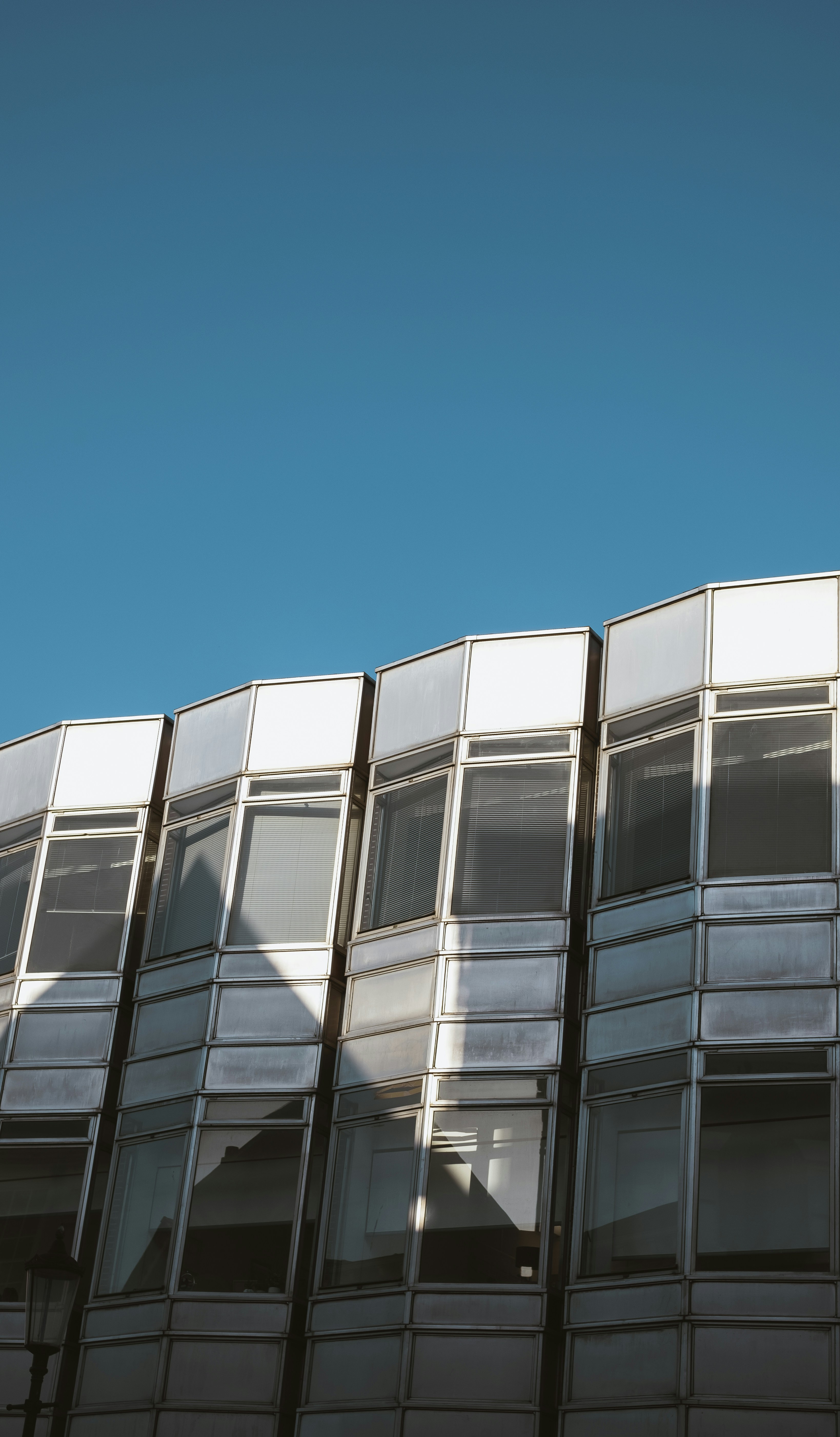 a tall building with lots of windows on top of it