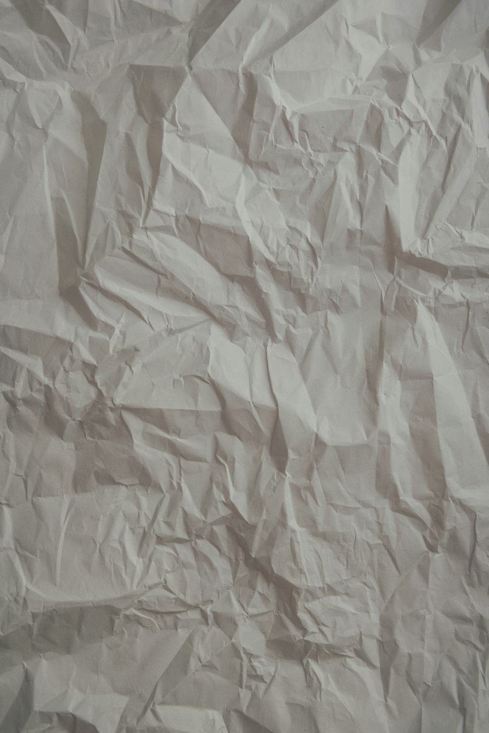 a piece of white paper that has been wrinkled