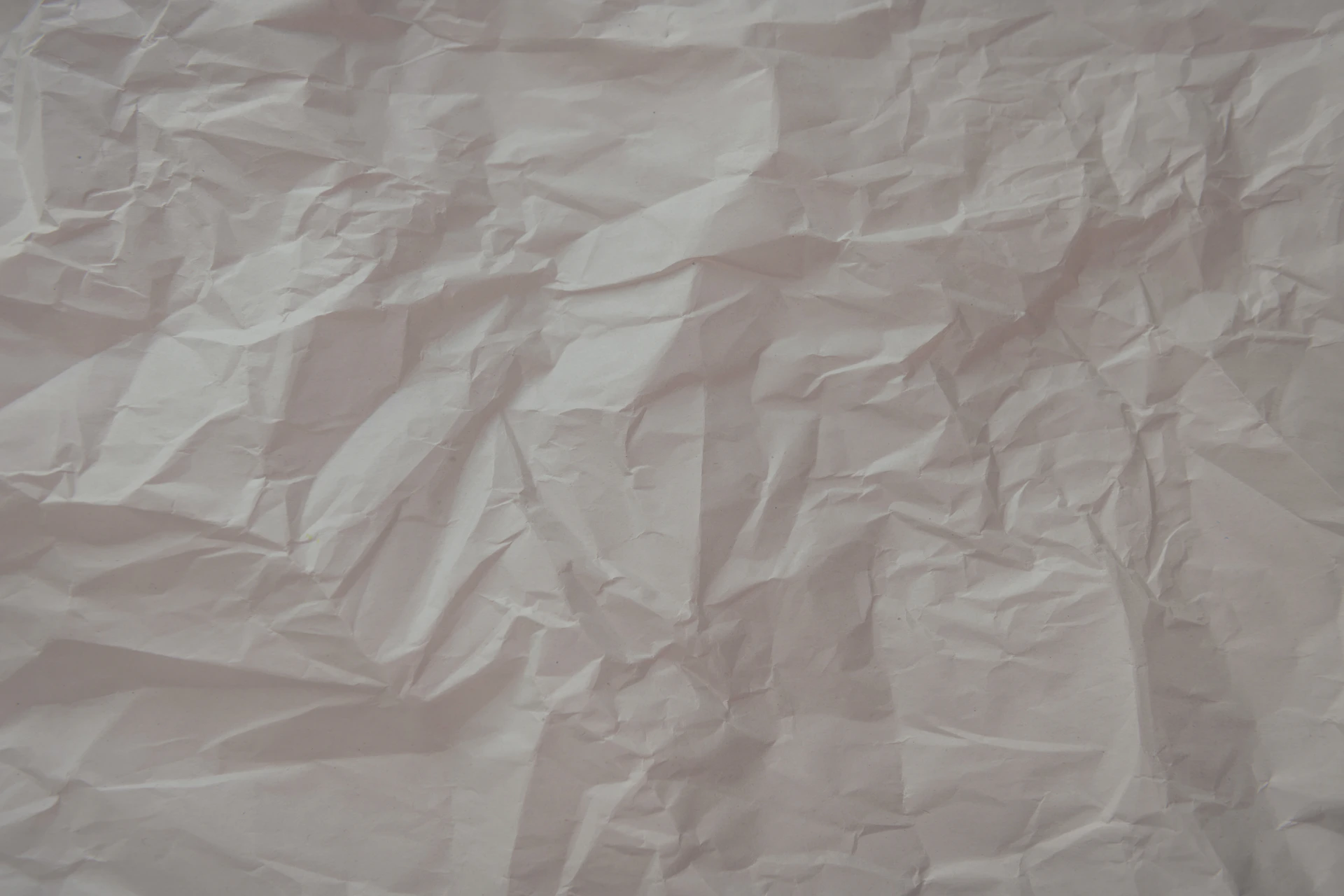 a piece of white paper that has been wrinkled