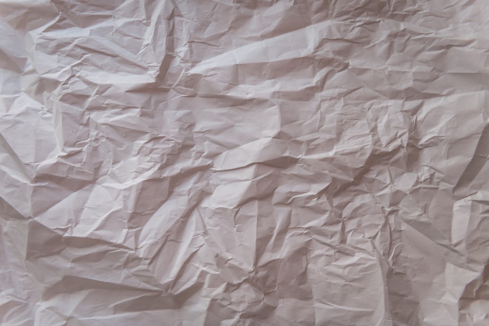 a piece of white paper that has been wrinkled