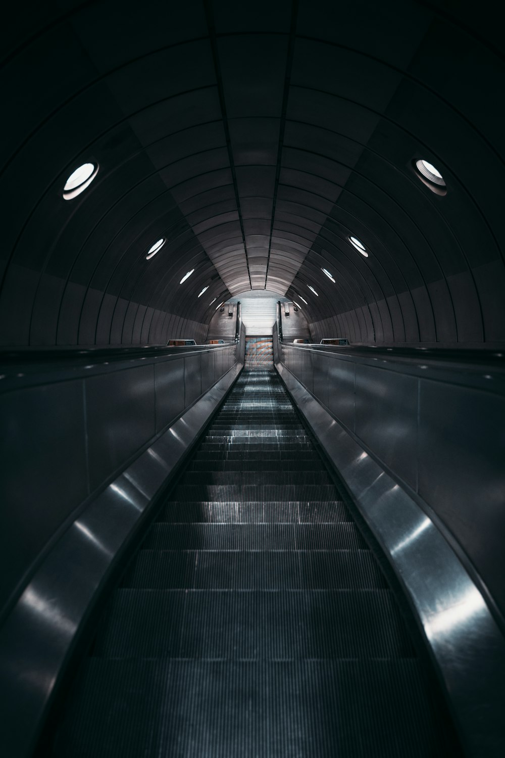 an empty escalator in a subway station