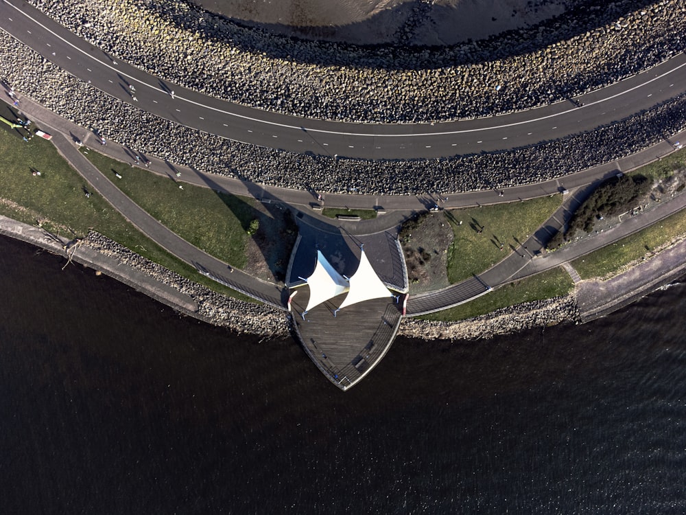 an aerial view of a road and a building