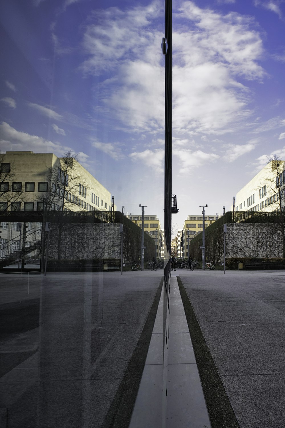 a street light on a city street with buildings in the background