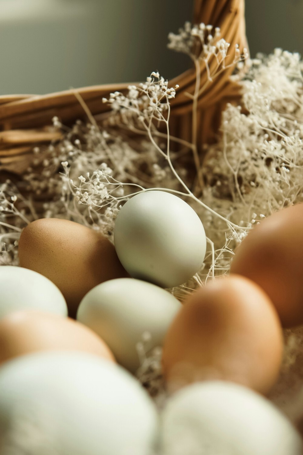 a basket filled with eggs sitting on top of a table