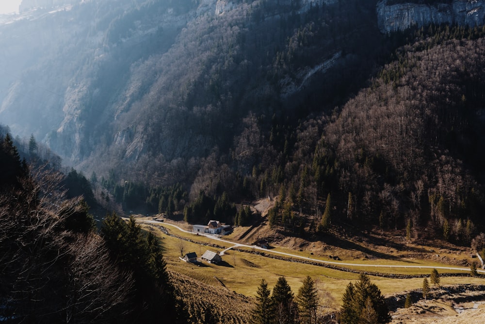 a scenic view of a mountain with a winding road