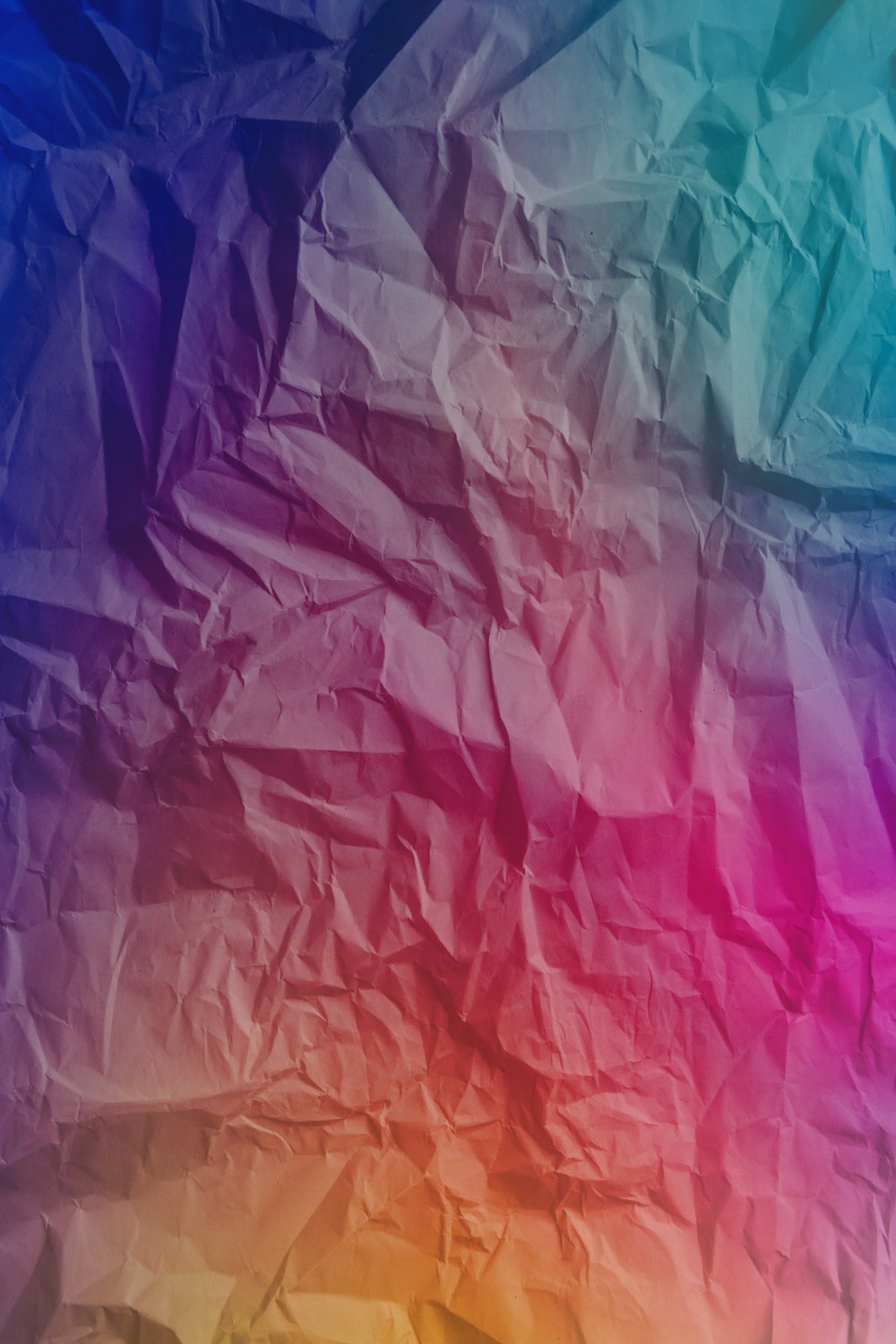 a multicolored background of crumpled paper