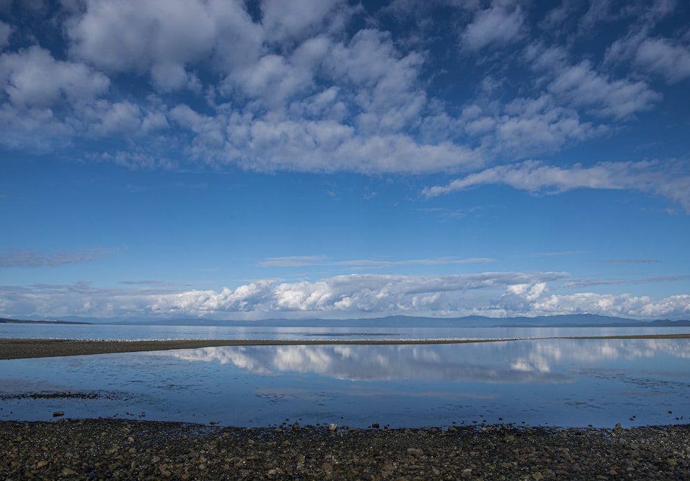 a large body of water surrounded by rocks