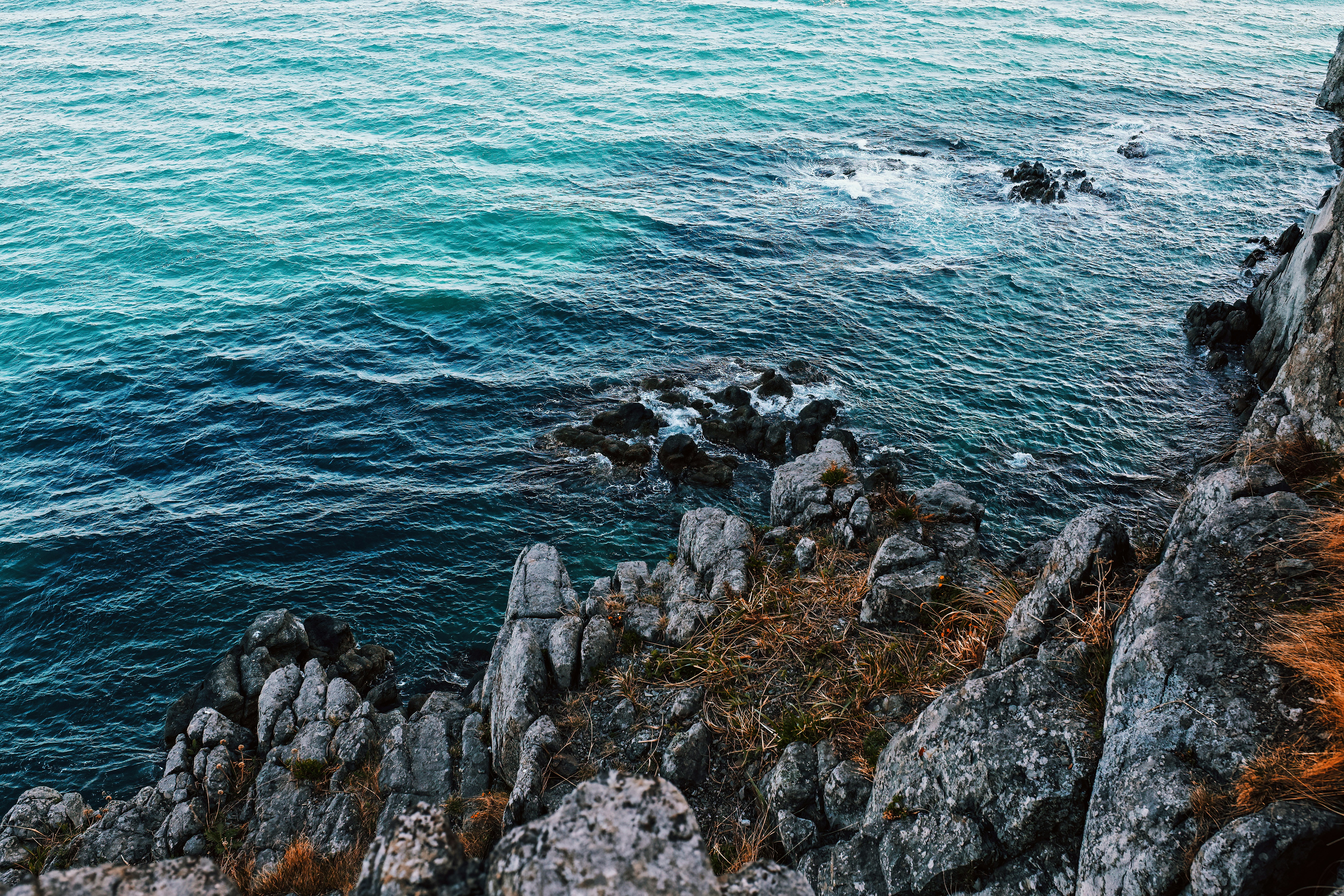 a view of a body of water from a cliff