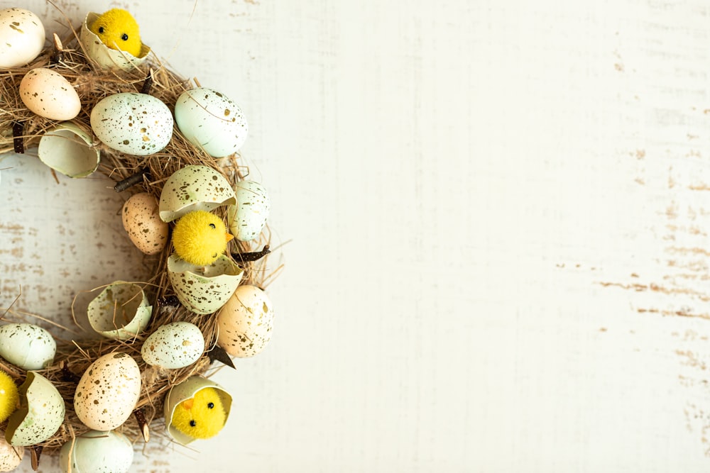 a wreath made out of eggs on a white background