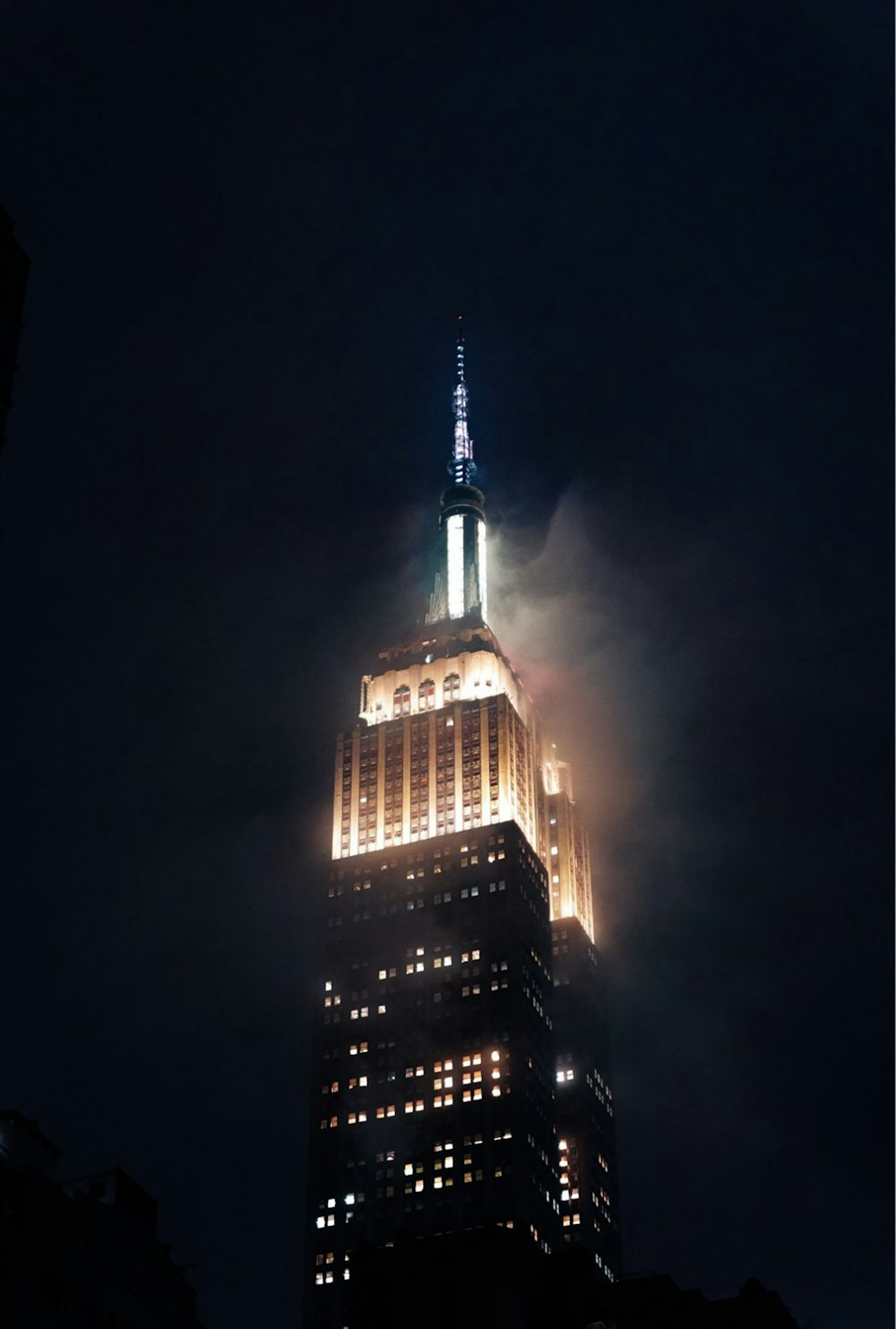 a very tall building lit up at night