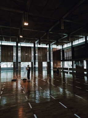 A welcoming sports hall in Yeruham filled with diverse athletes training together.