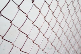 a close up of a chain link fence