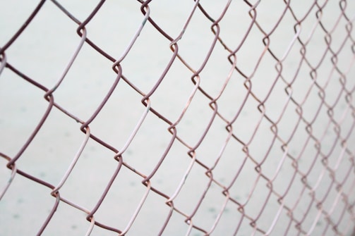 a close up of a chain link fence