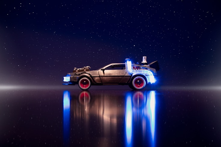 a car that is sitting in the middle of a body of water