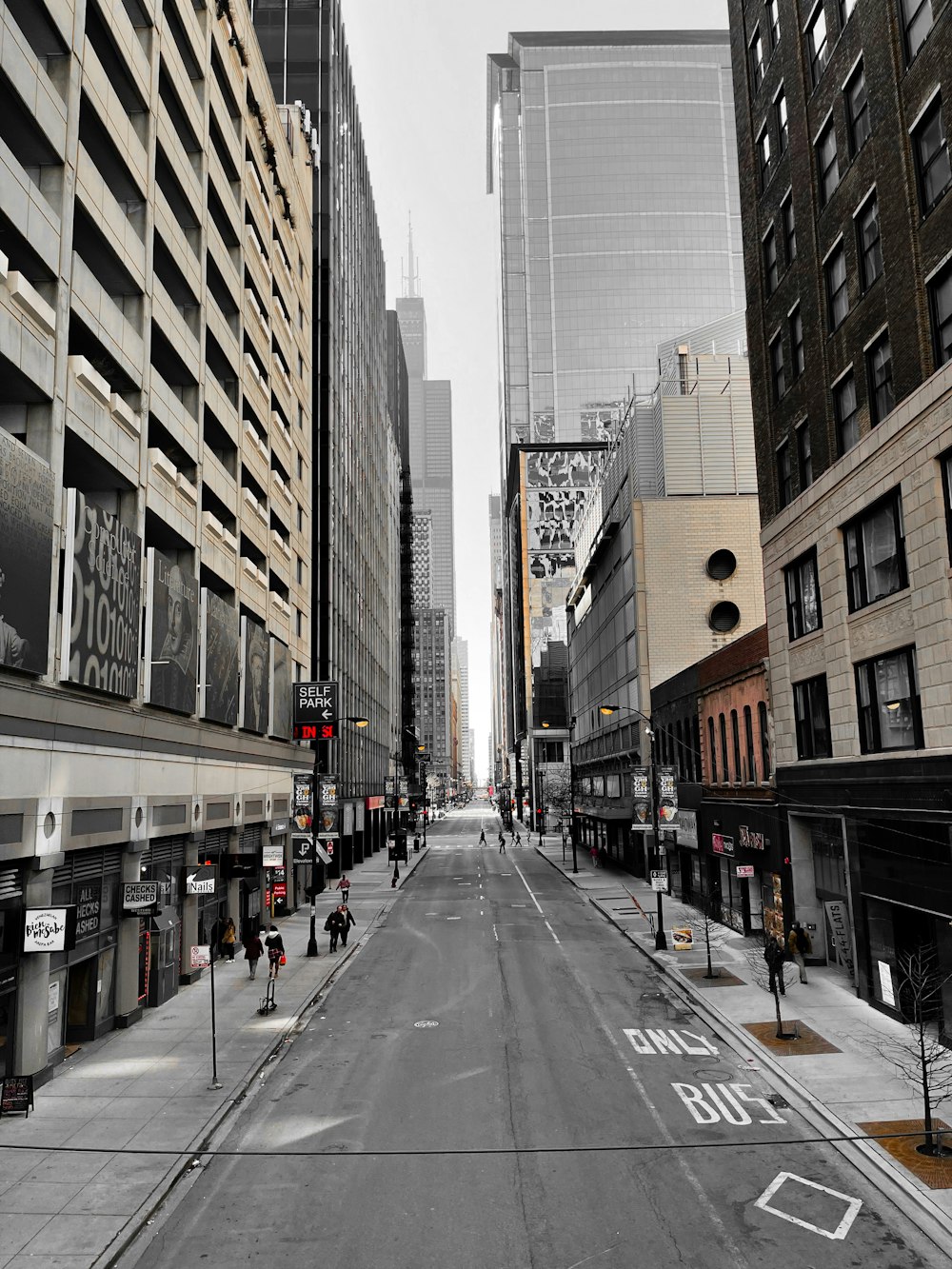 a city street lined with tall buildings and tall buildings