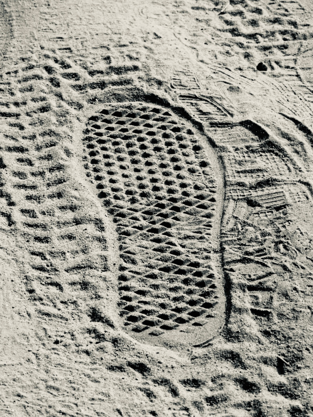 a person's foot prints in the sand on a beach