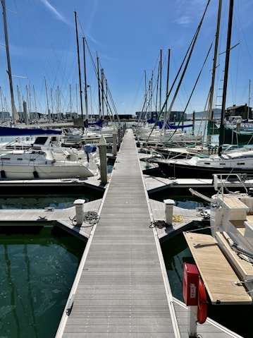 a dock with many boats in the water