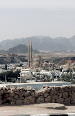 a view of a city with mountains in the background