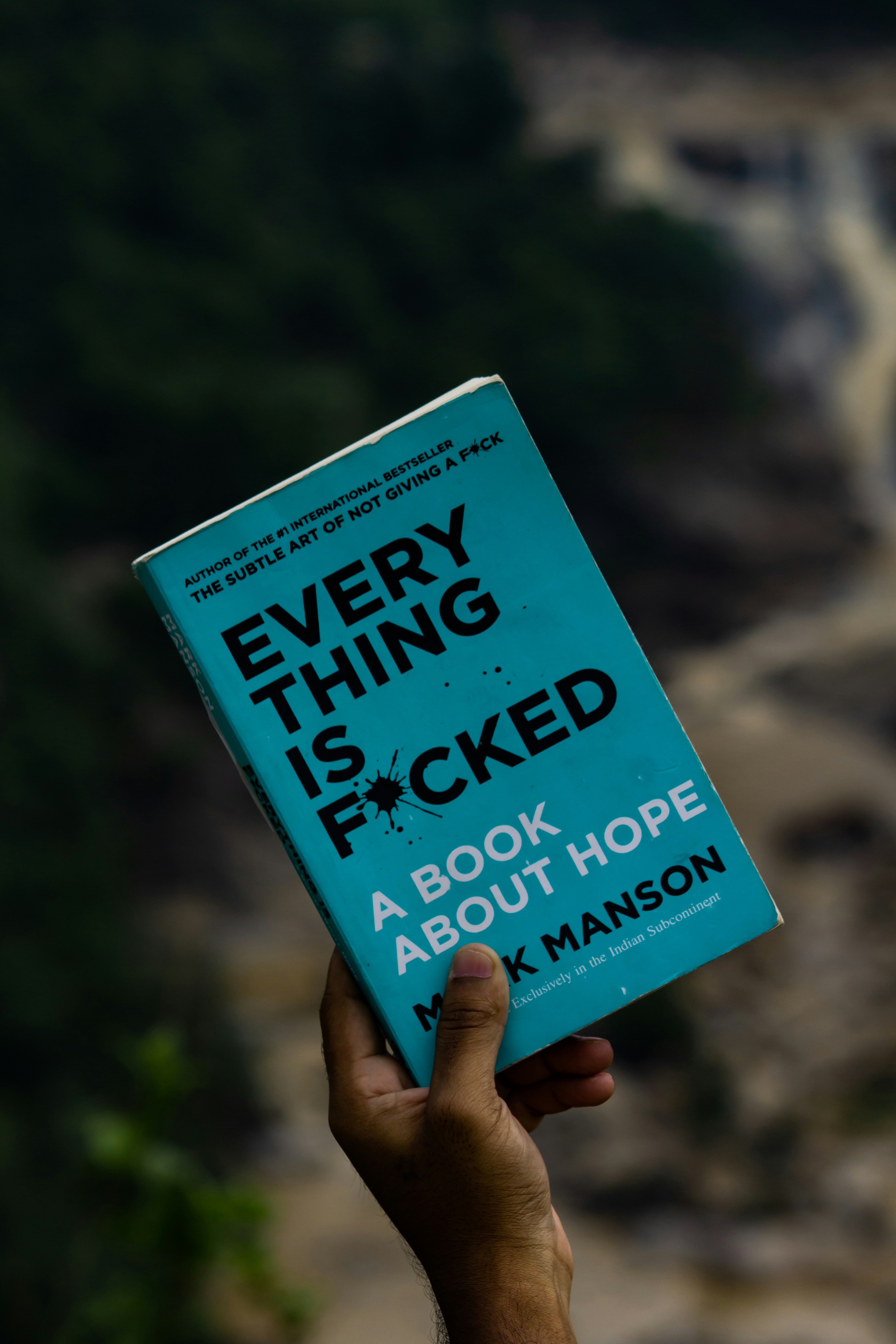 a person holding a book in their hand