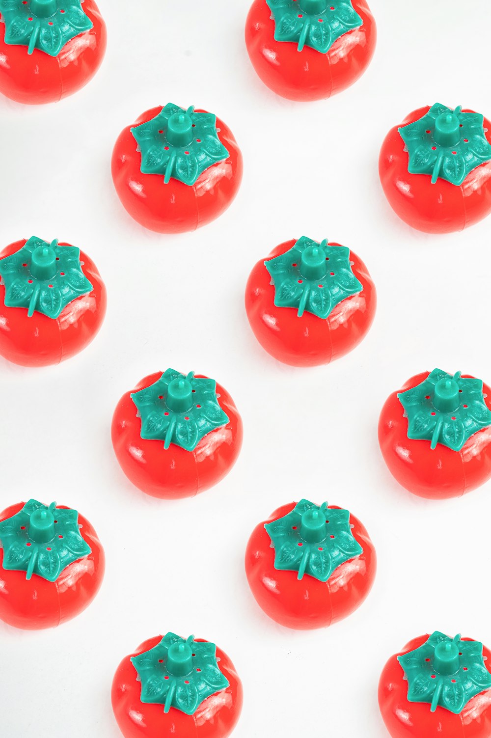 a group of red and green buttons on a white surface