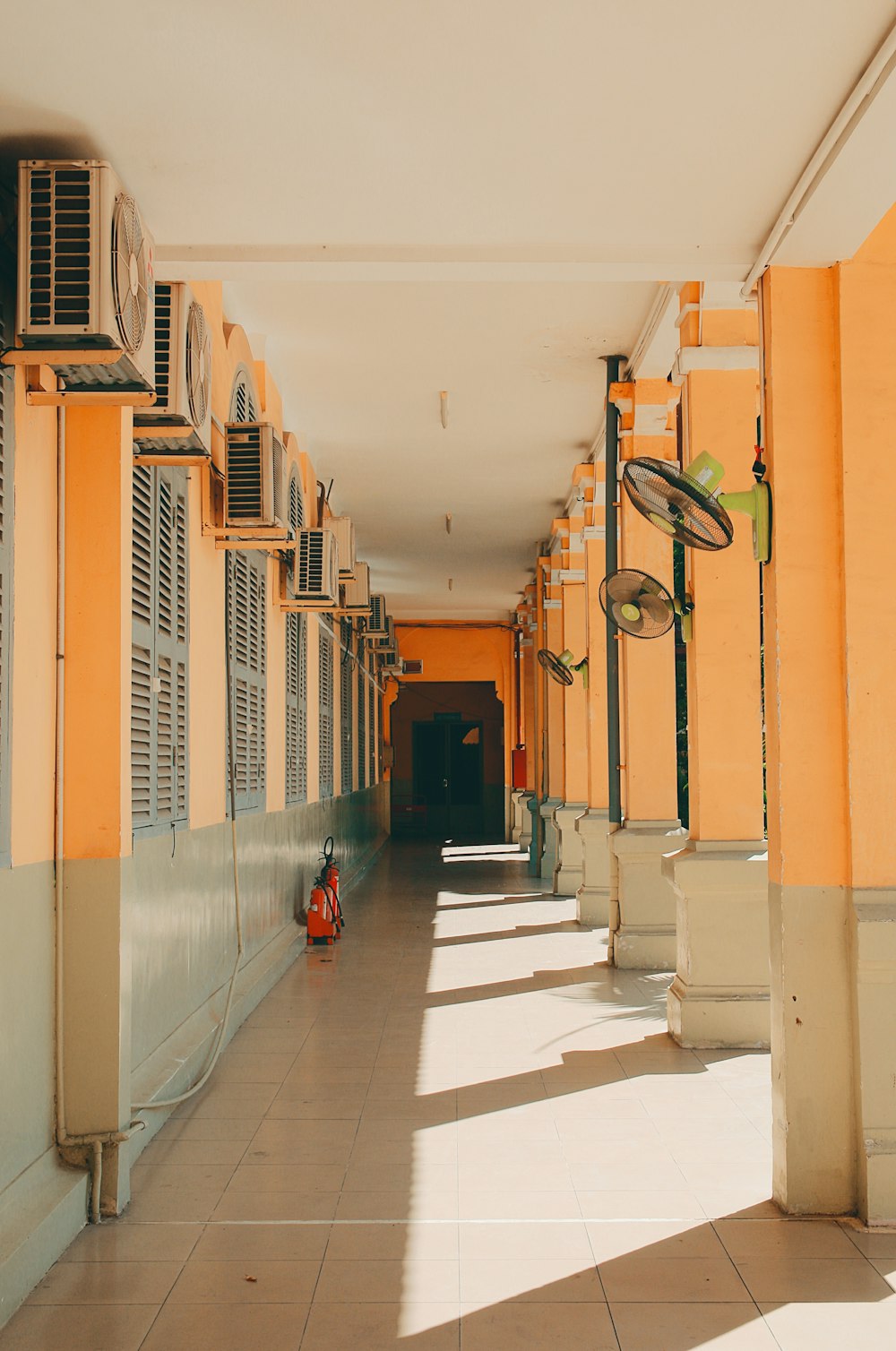 a long hallway with a bunch of windows