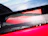 Close-up of a shiny red Ferrari engine part with the Rossoveloce logo subtly visible.