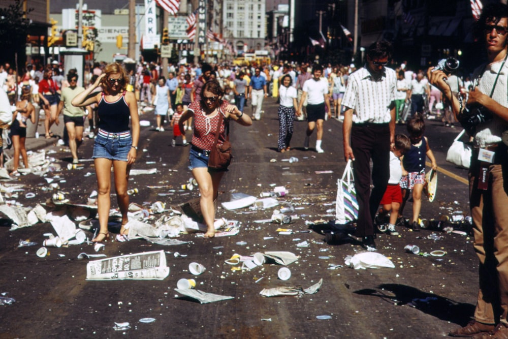 a large group of people walking down a street