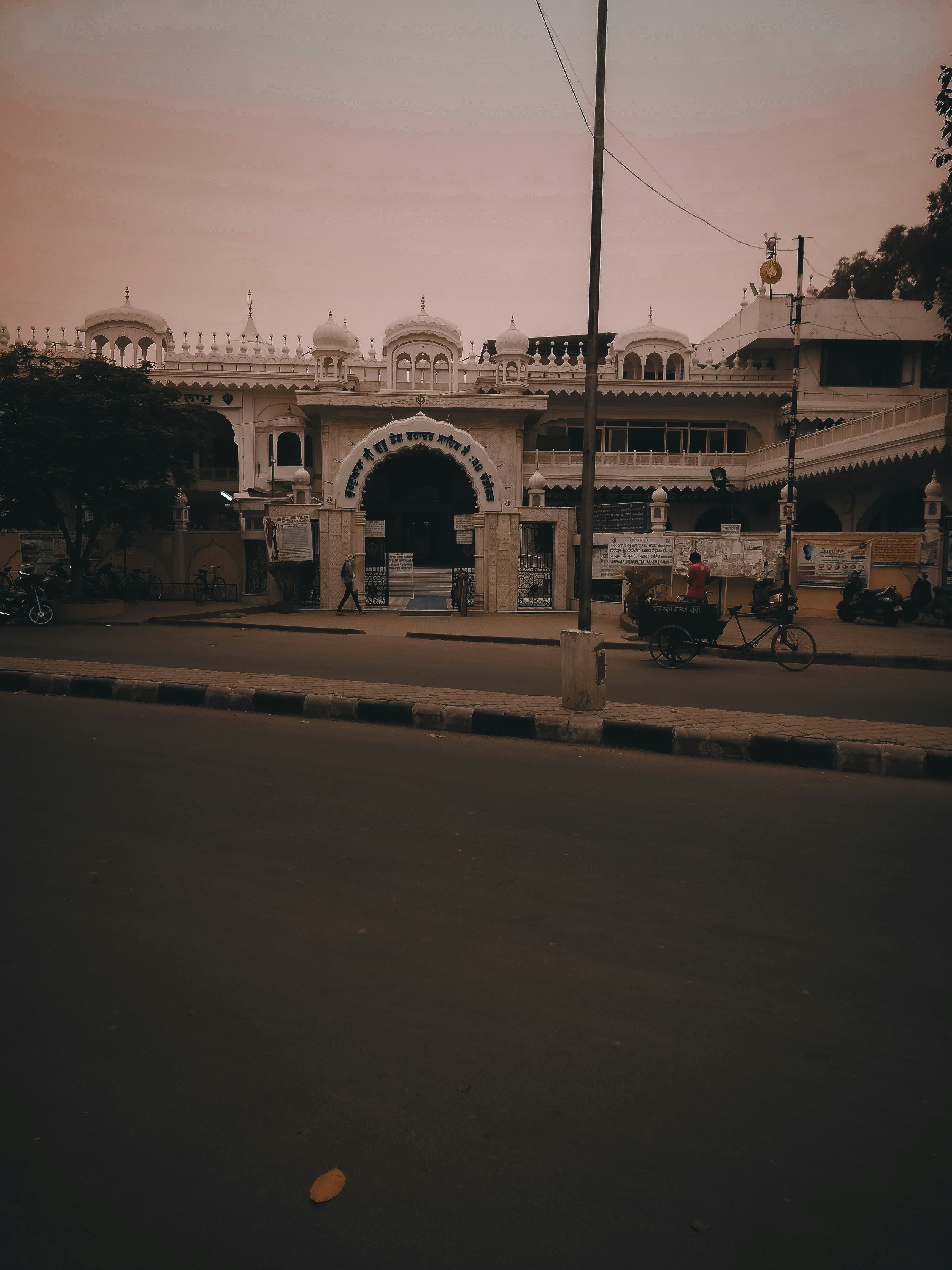 an old building with a bicycle parked in front of it