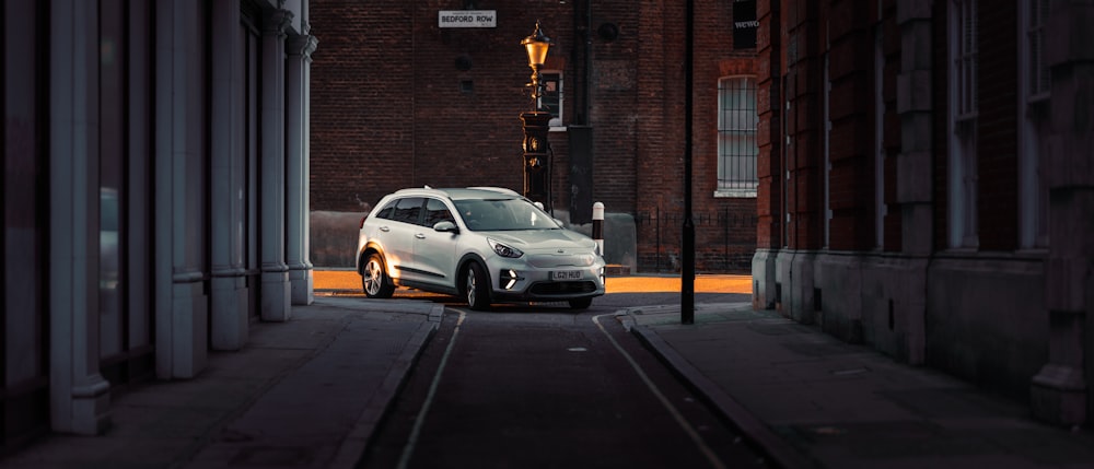 a white car parked on the side of a road