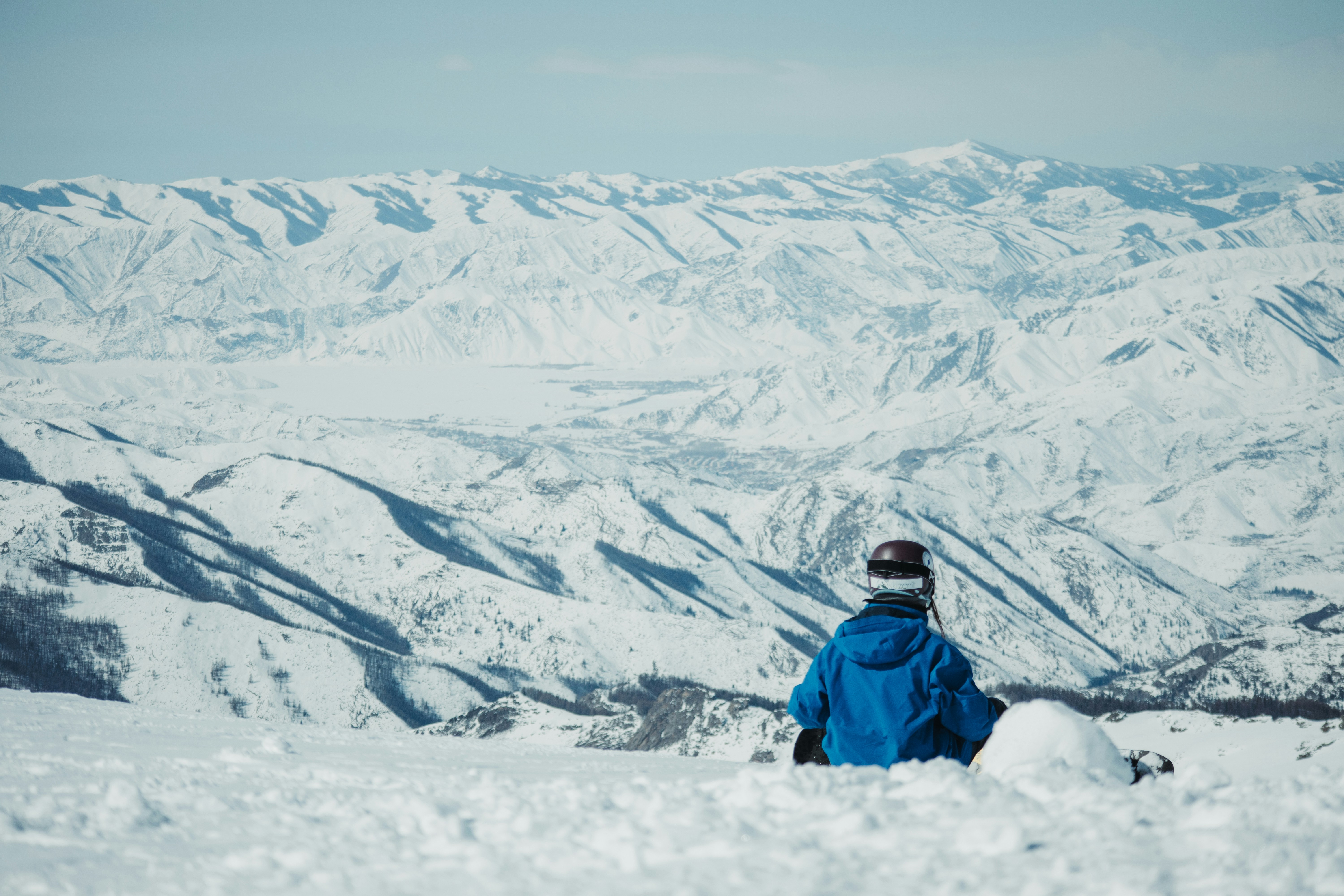 a person standing on top of a snow covered slope