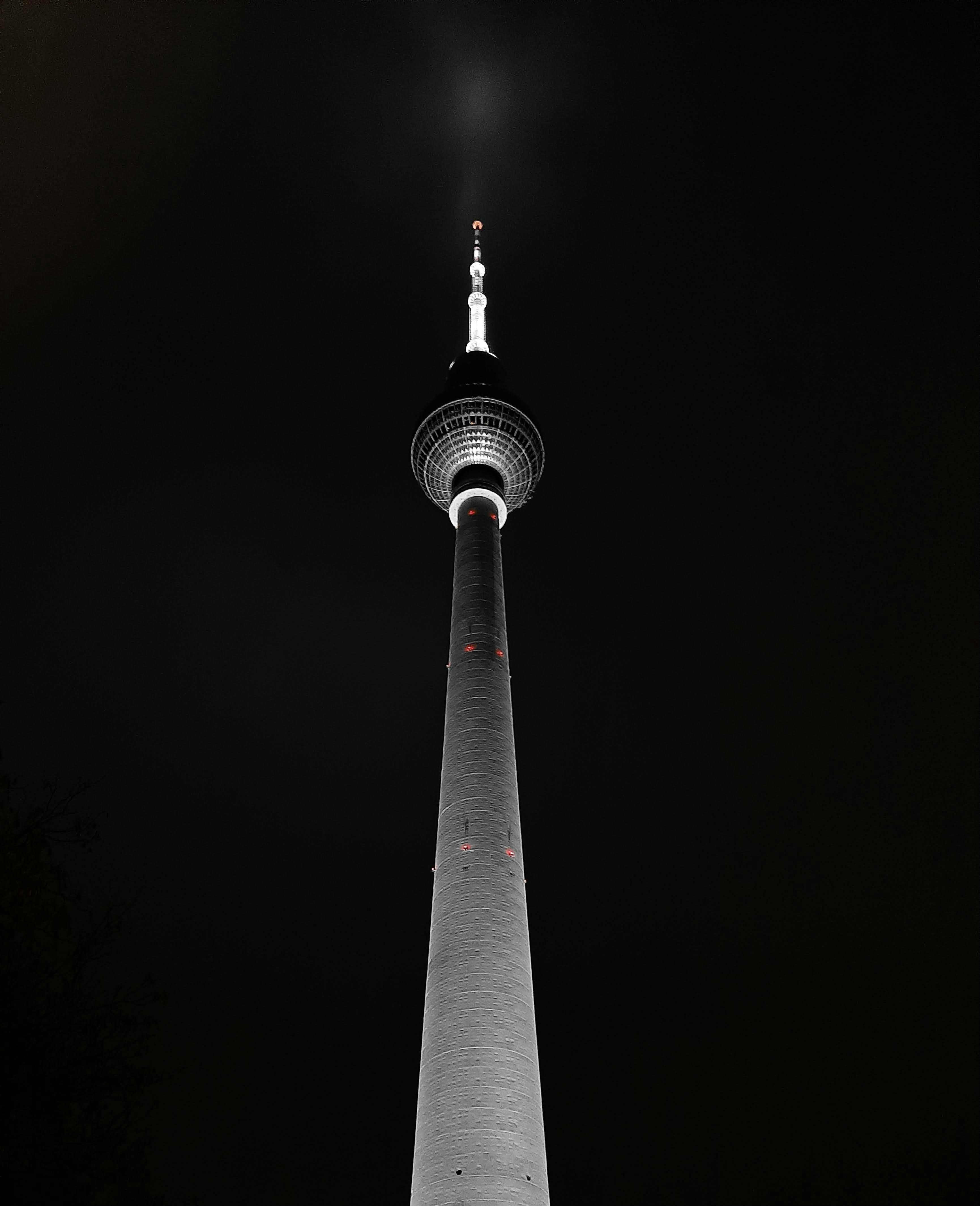a very tall tower lit up at night