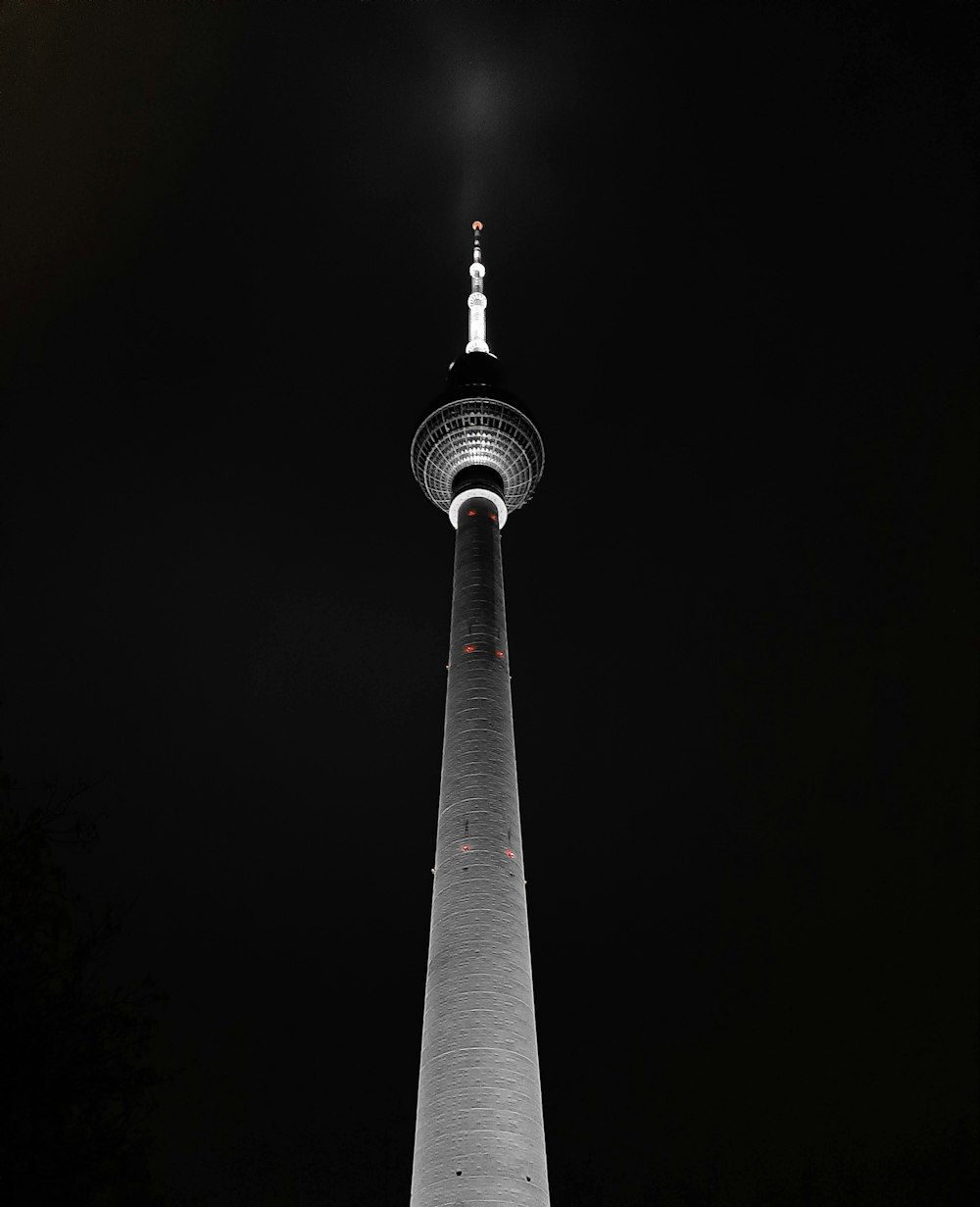 a very tall tower lit up at night