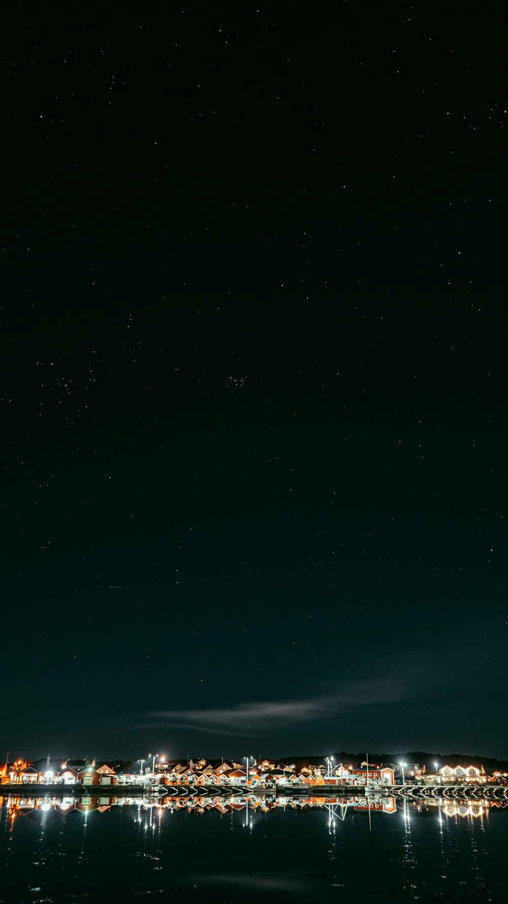 a night view of the city lights and water