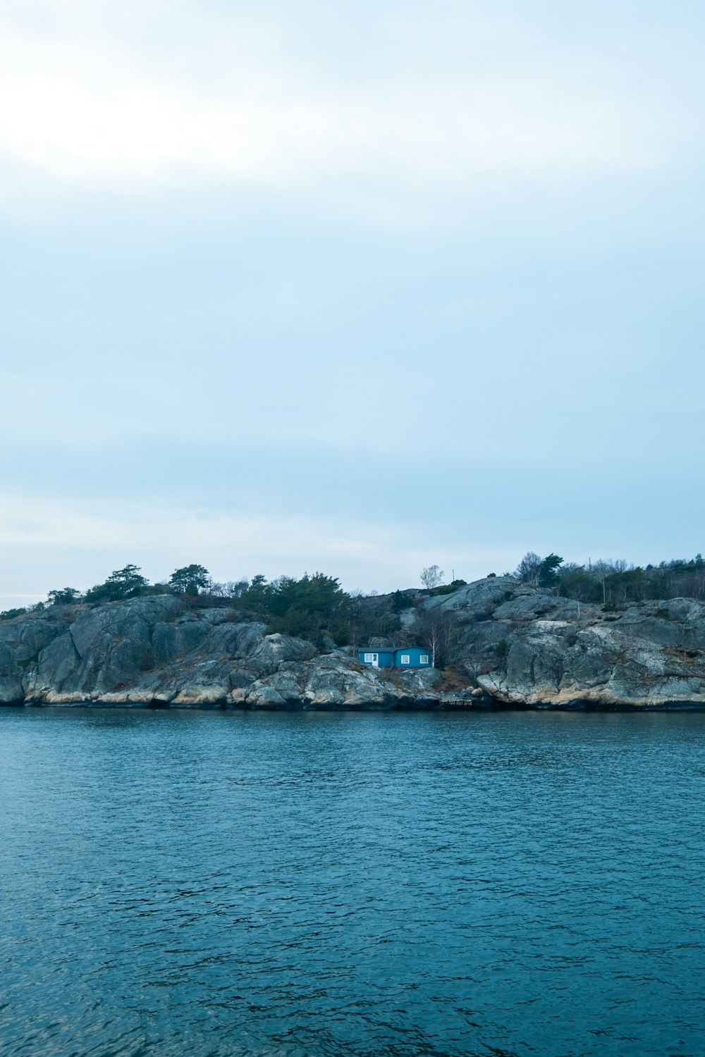 a body of water with a small island in the background