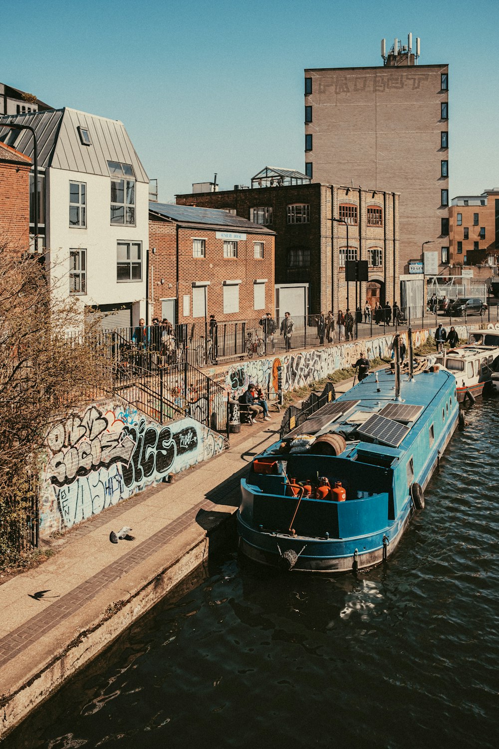 a blue boat in a body of water