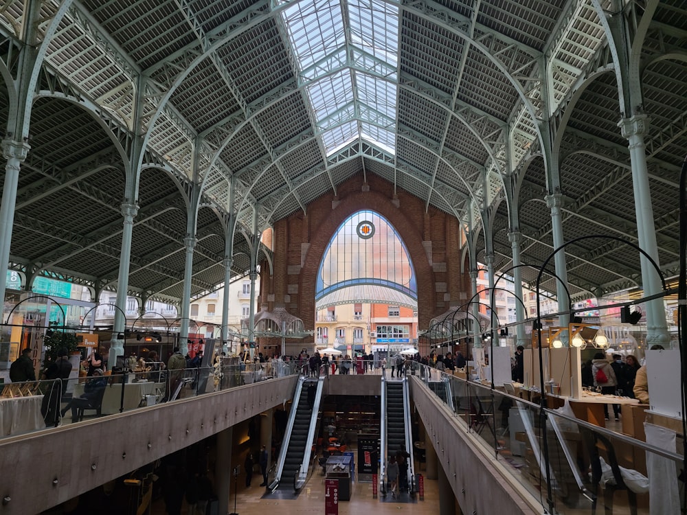 a train station with people walking up and down the stairs