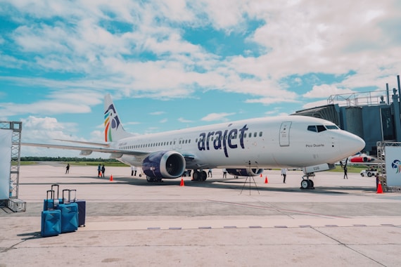 a large jetliner sitting on top of an airport tarmac