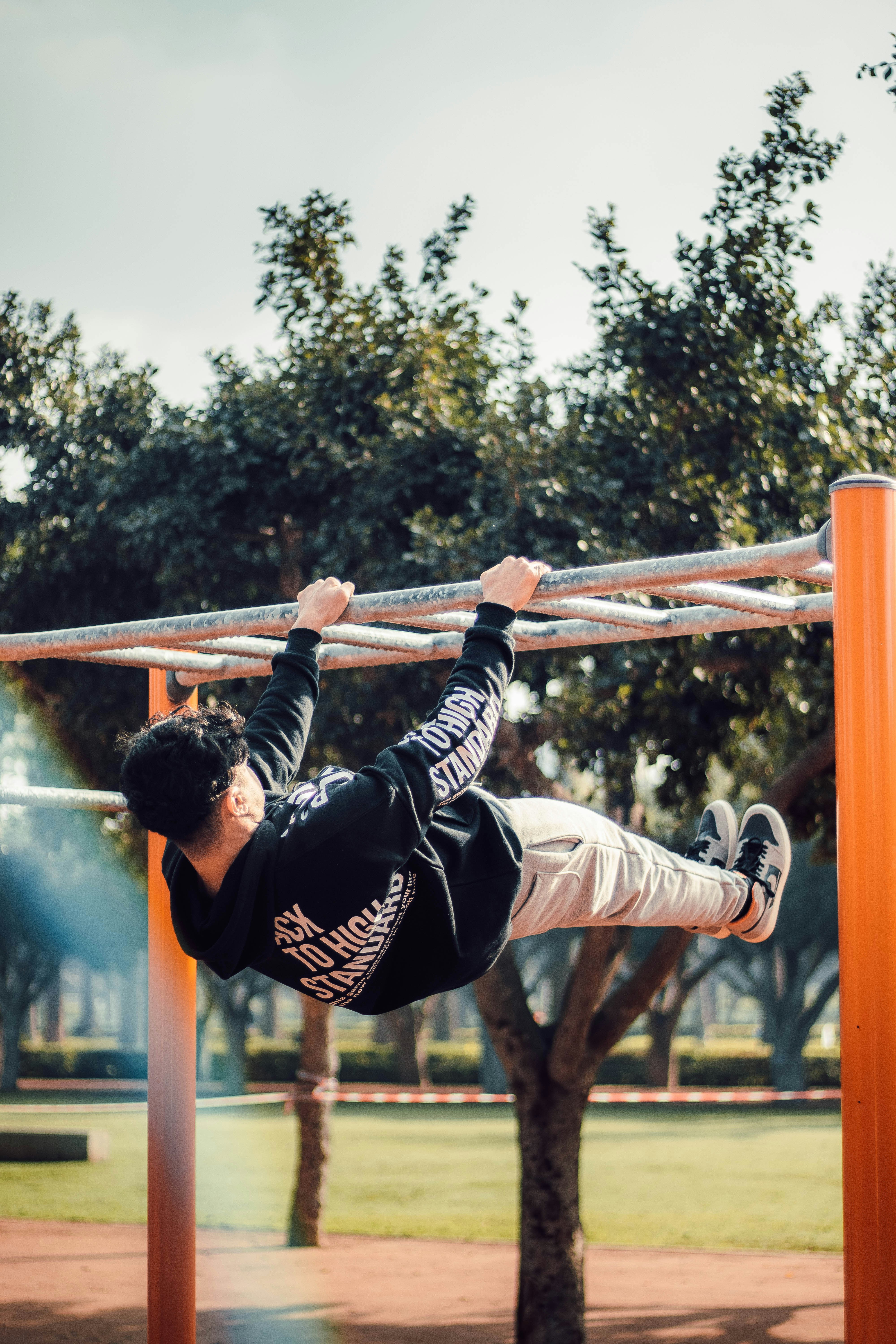 a man is doing a pull up on a bar