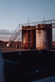 a large metal structure sitting in the middle of a desert