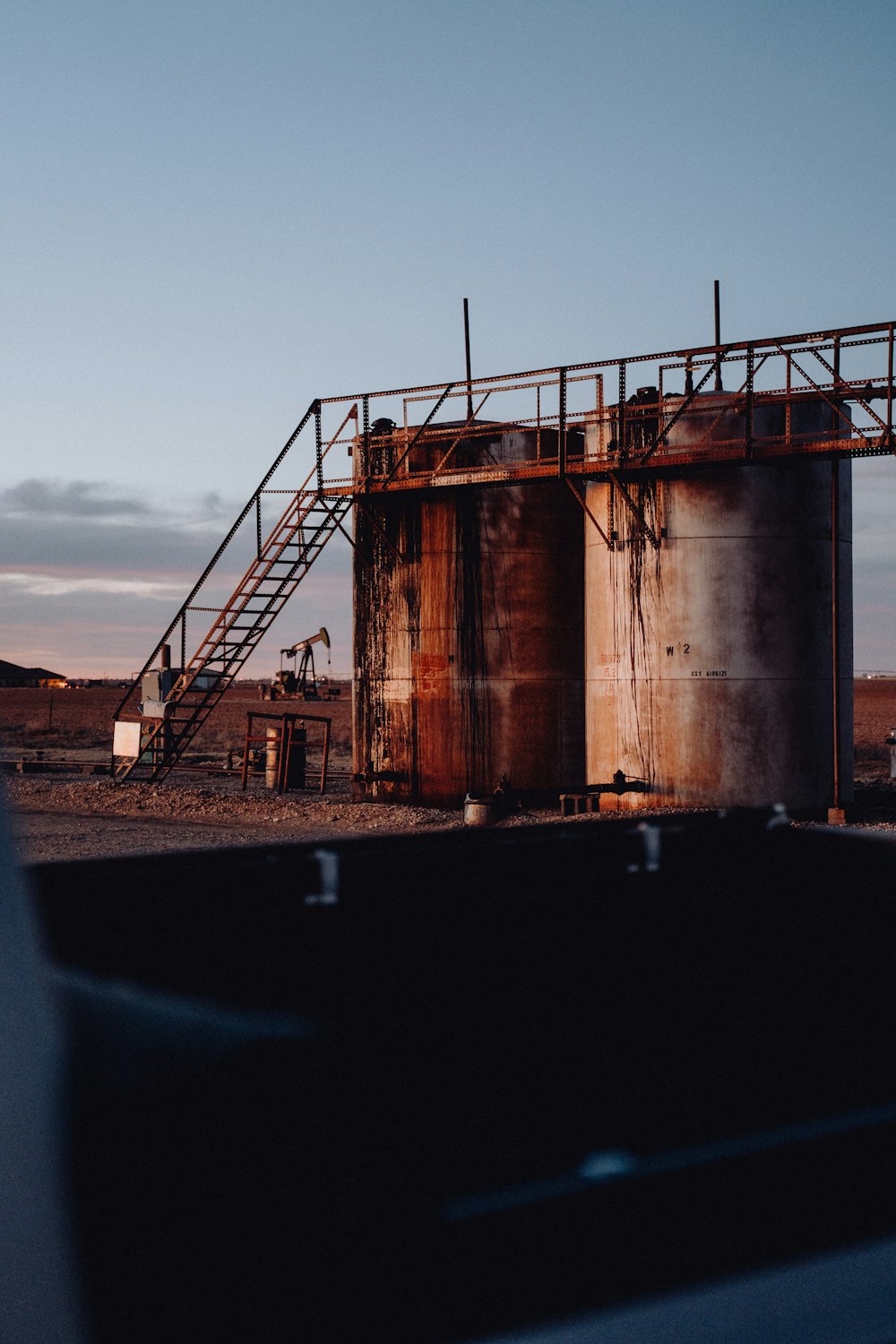 a large metal structure sitting in the middle of a desert