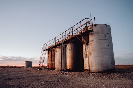 Photo of oil storage tanks at sunset in Kazakhstan.