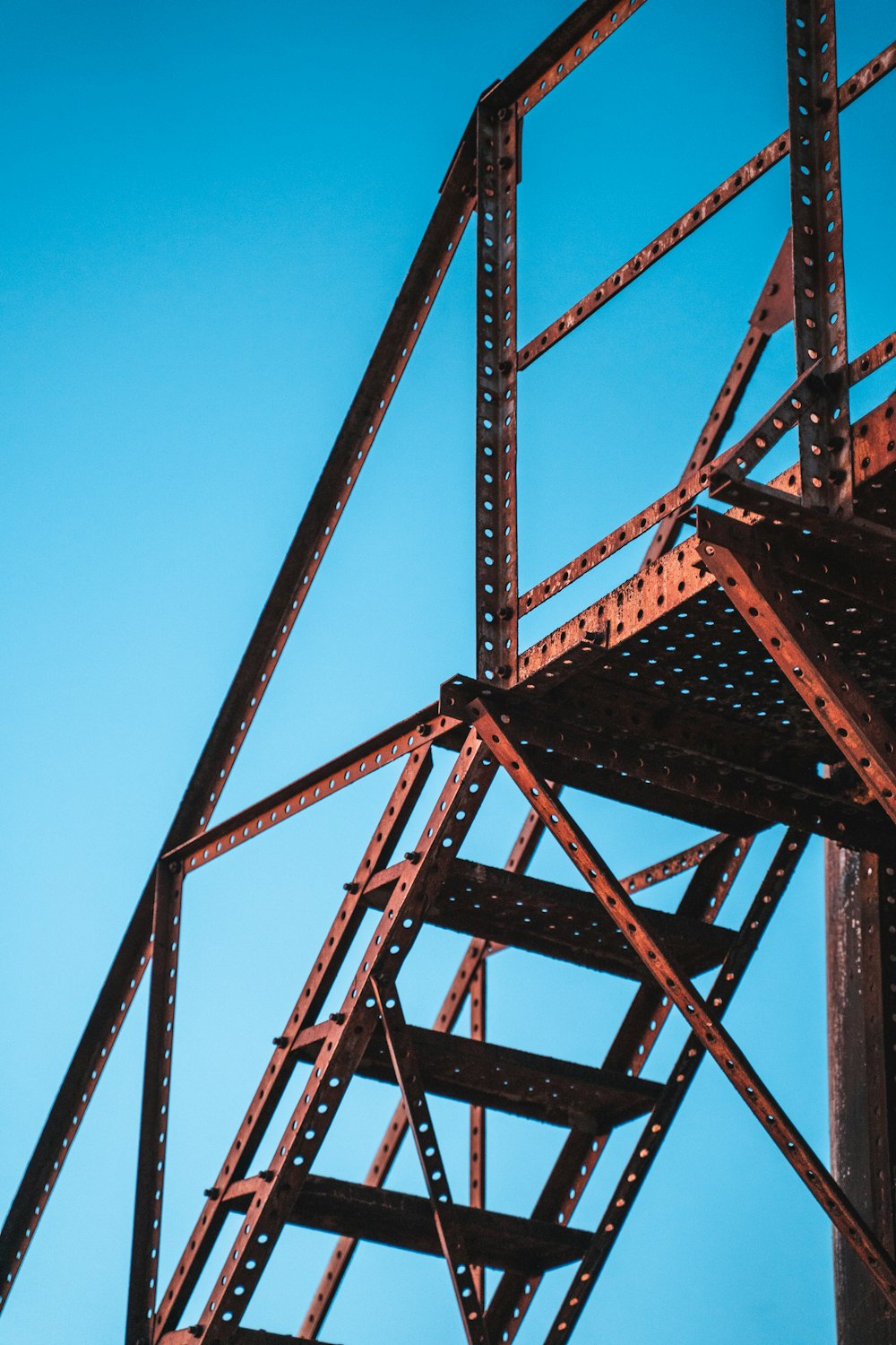 a close up of a metal structure against a blue sky