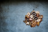 Close-up of colorful dried fruit slices arranged on a wooden board.