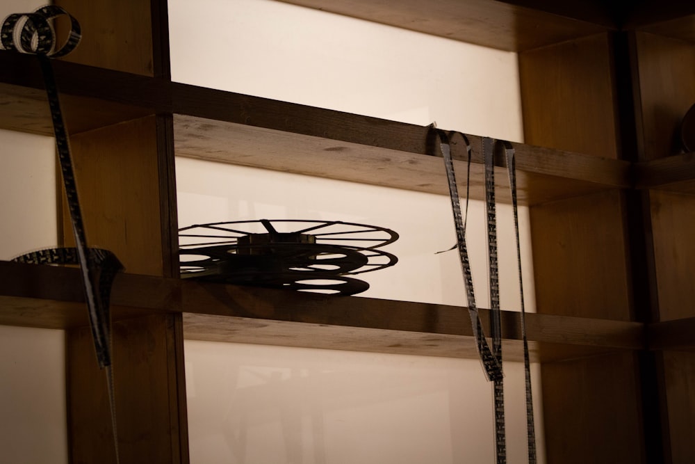 a metal object on a wooden shelf in a room