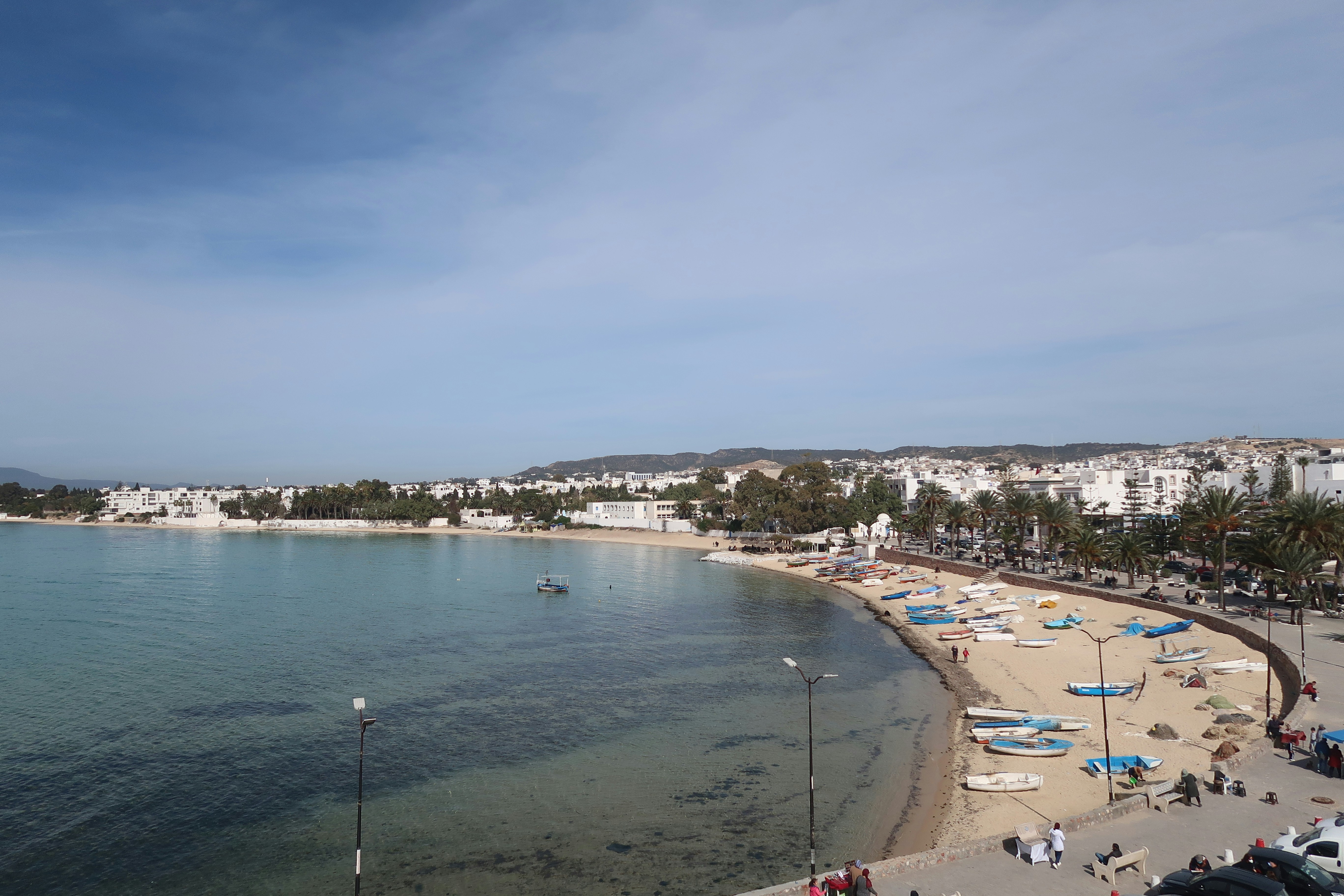 A beach with a lot of people on it