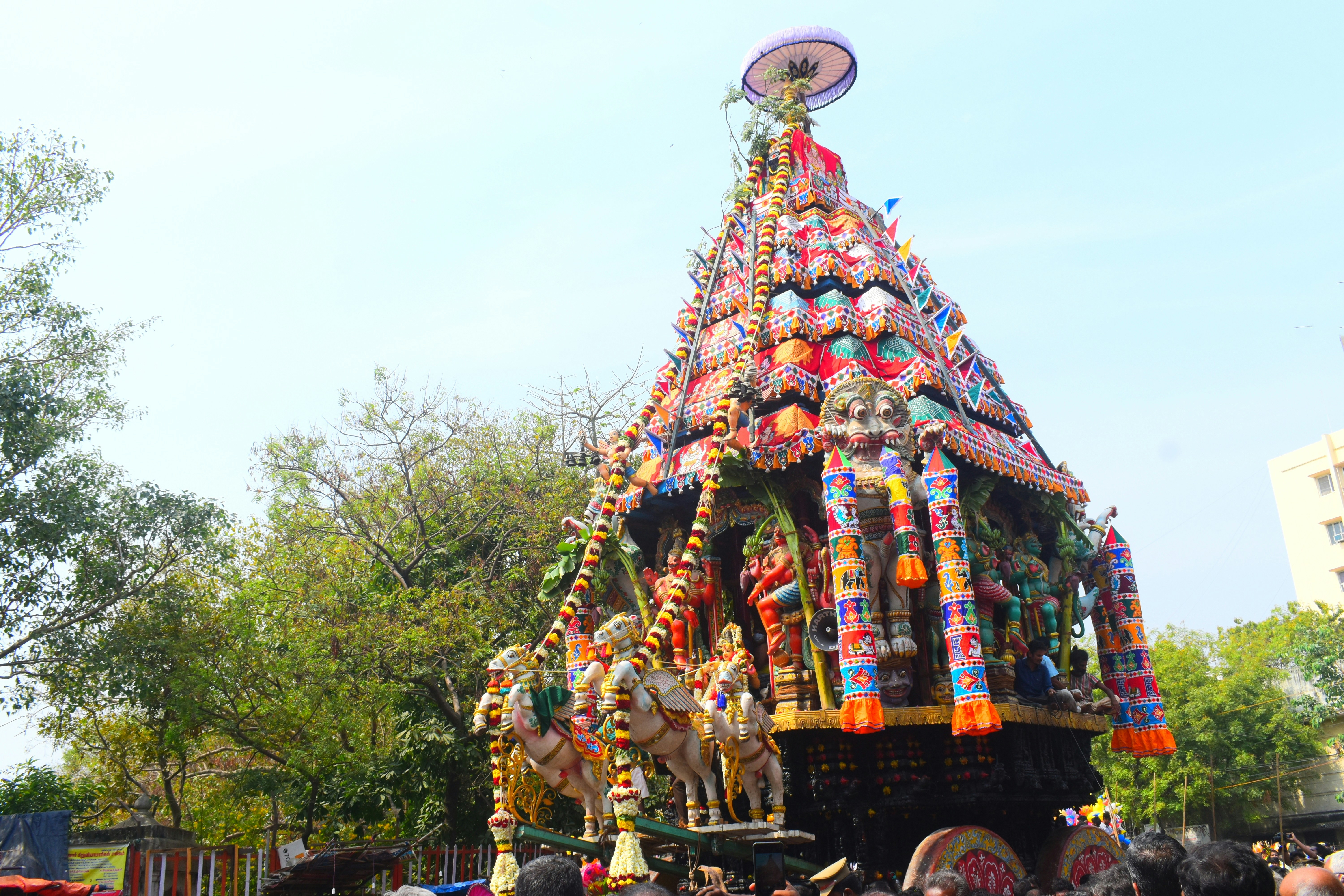 a colorfully decorated float in the middle of a street